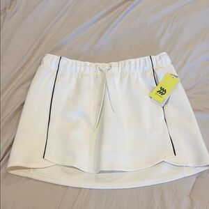 All in motion - White Athletic Skirt with Black Trim - size Medium